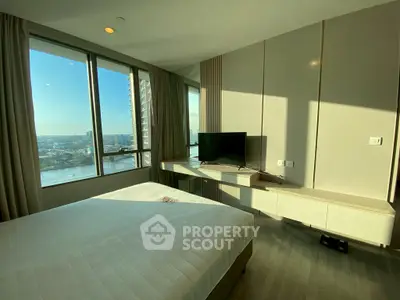 Modern bedroom with stunning city view and sleek furnishings