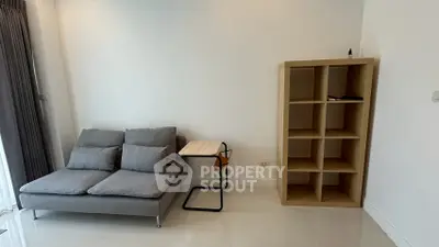Modern minimalist living room with sleek sofa and stylish shelving unit