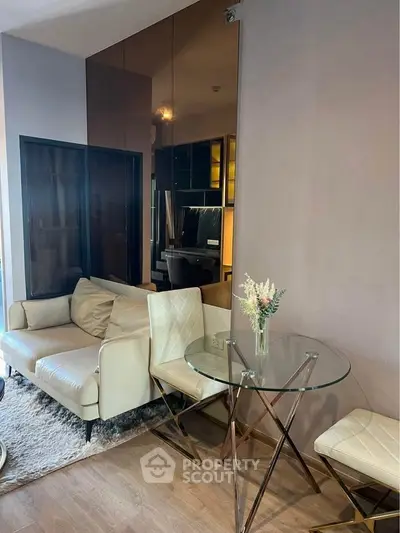 Modern living room with elegant glass table and plush seating