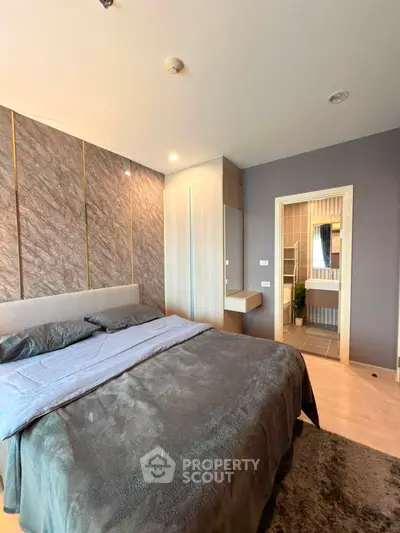 Modern bedroom with ensuite bathroom and stylish decor