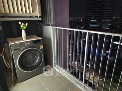 Modern balcony with city view and washing machine, perfect for urban living.