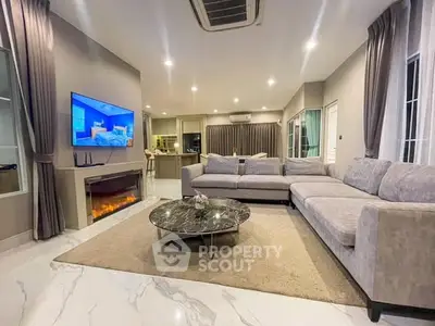 Luxurious modern living room with elegant decor and spacious seating area.
