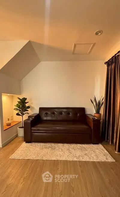 Cozy living room with stylish leather sofa and warm lighting