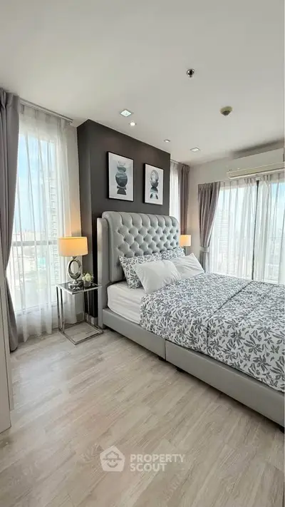 Luxurious bedroom with elegant decor and panoramic city views