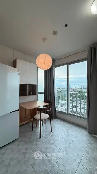 Modern kitchen with stunning city view, featuring sleek design and natural light.