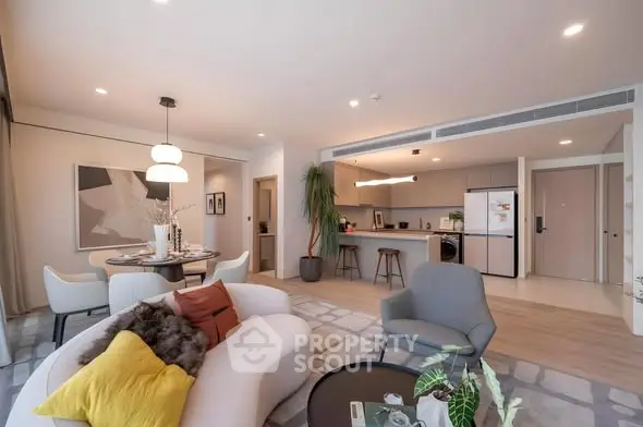 Spacious modern living room with open kitchen and stylish decor