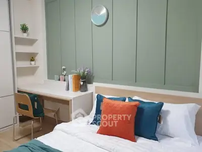 Modern bedroom with stylish decor and workspace, featuring a comfortable bed and elegant design.