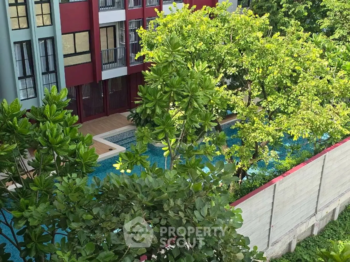 Lush garden view with pool at modern residential building