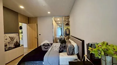 Modern bedroom with stylish decor and ample storage space