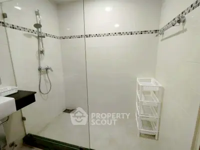 Modern bathroom with glass shower and sleek tile design