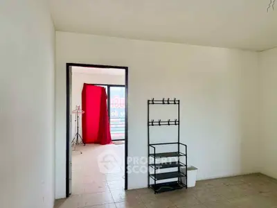 Spacious interior with tiled flooring and minimalistic decor, ideal for customization.