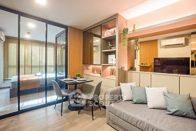 Modern open-plan living room with stylish decor and cozy seating area