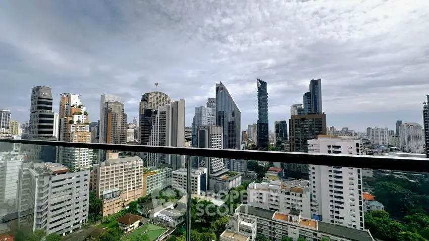 Stunning city skyline view from a high-rise balcony with modern skyscrapers.