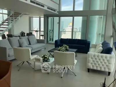 Luxurious modern living room with panoramic city views and elegant furnishings.