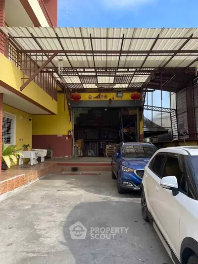 Spacious commercial property with ample parking and modern facade, ideal for business operations.