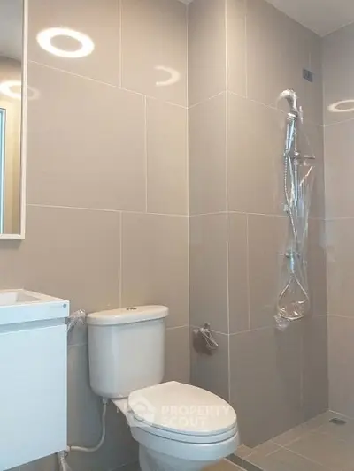 Modern bathroom with sleek tiles and shower area