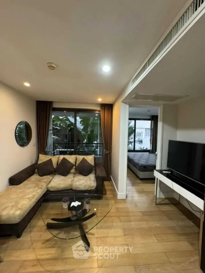 Modern living room with cozy sofa and large window view