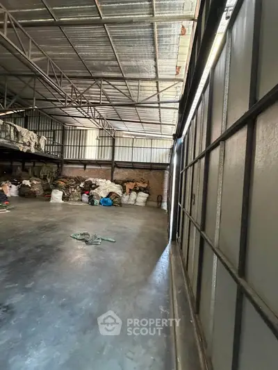 Spacious industrial warehouse with high ceilings and ample storage space.