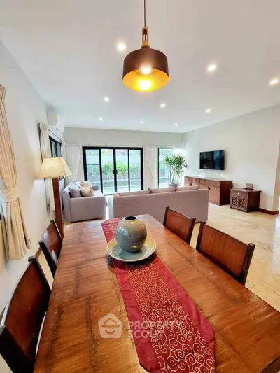 Spacious living room with elegant dining area and modern decor