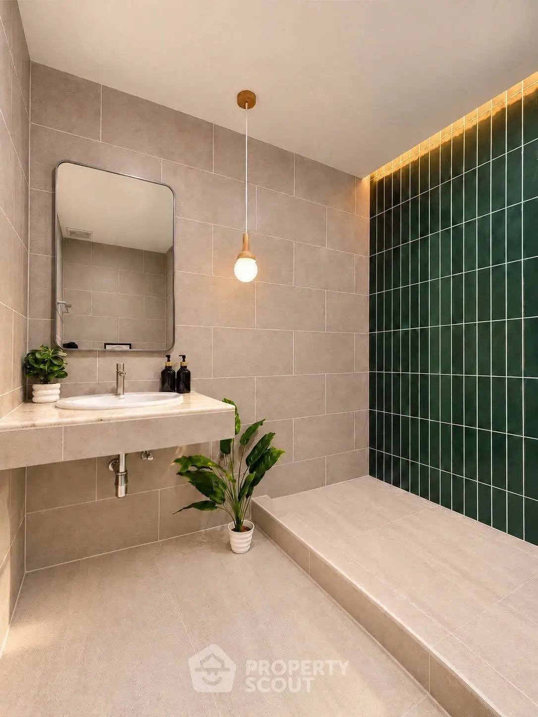 Modern bathroom with stylish green tile accent wall and elegant lighting.