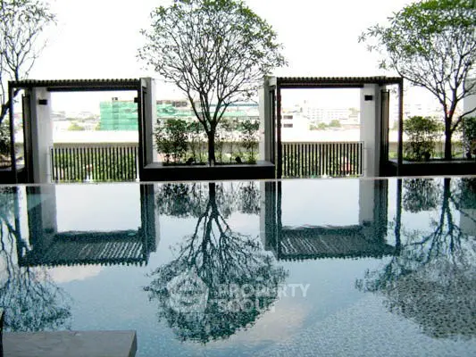 Luxurious rooftop pool with stunning city view and elegant design.