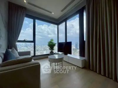 Luxurious corner unit living room with panoramic city views and modern decor.