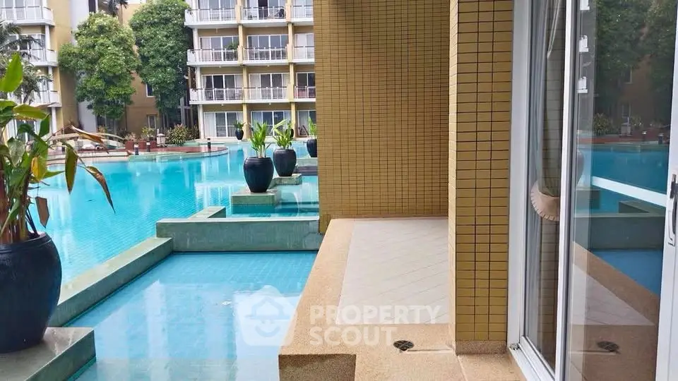 Luxurious poolside view with modern architecture and serene ambiance.