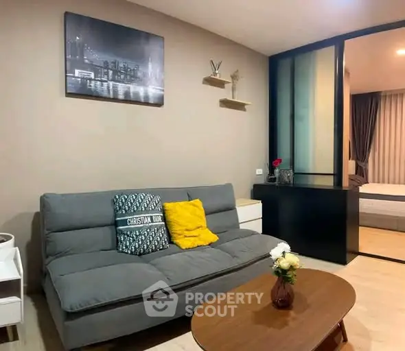 Modern living room with stylish decor and cozy seating in a contemporary apartment.