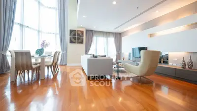 Spacious modern living room with elegant decor and large windows for natural light.
