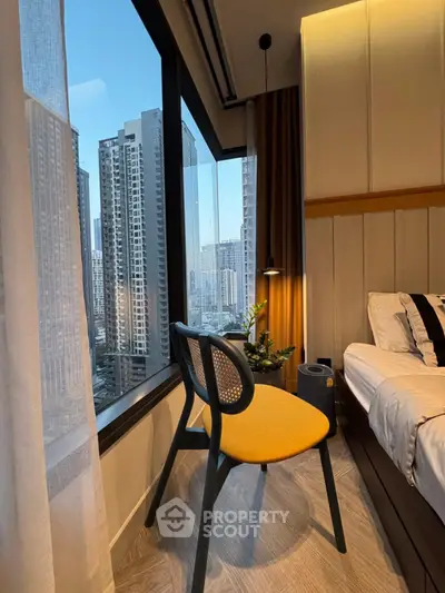 Modern bedroom with city view and stylish furniture