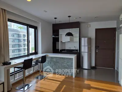 Modern kitchen with open layout and stylish breakfast bar in urban apartment