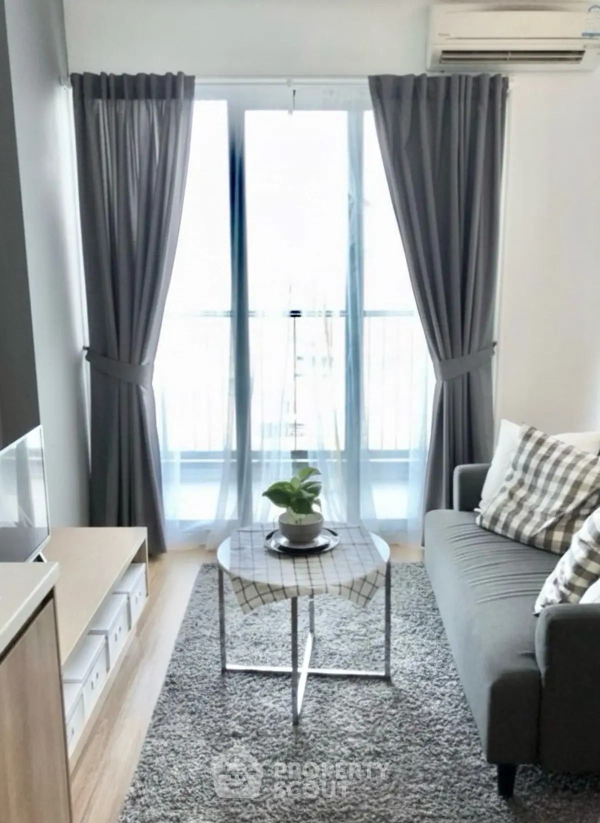 Cozy living room with modern decor and large window view