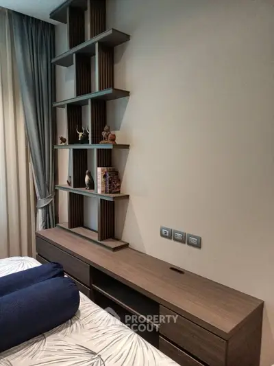 Modern bedroom with stylish shelving and elegant decor