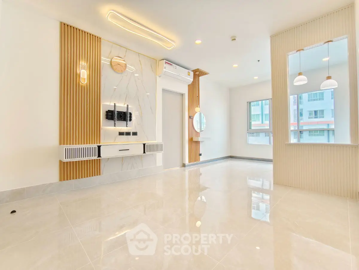 Modern living room with elegant design and ample natural light