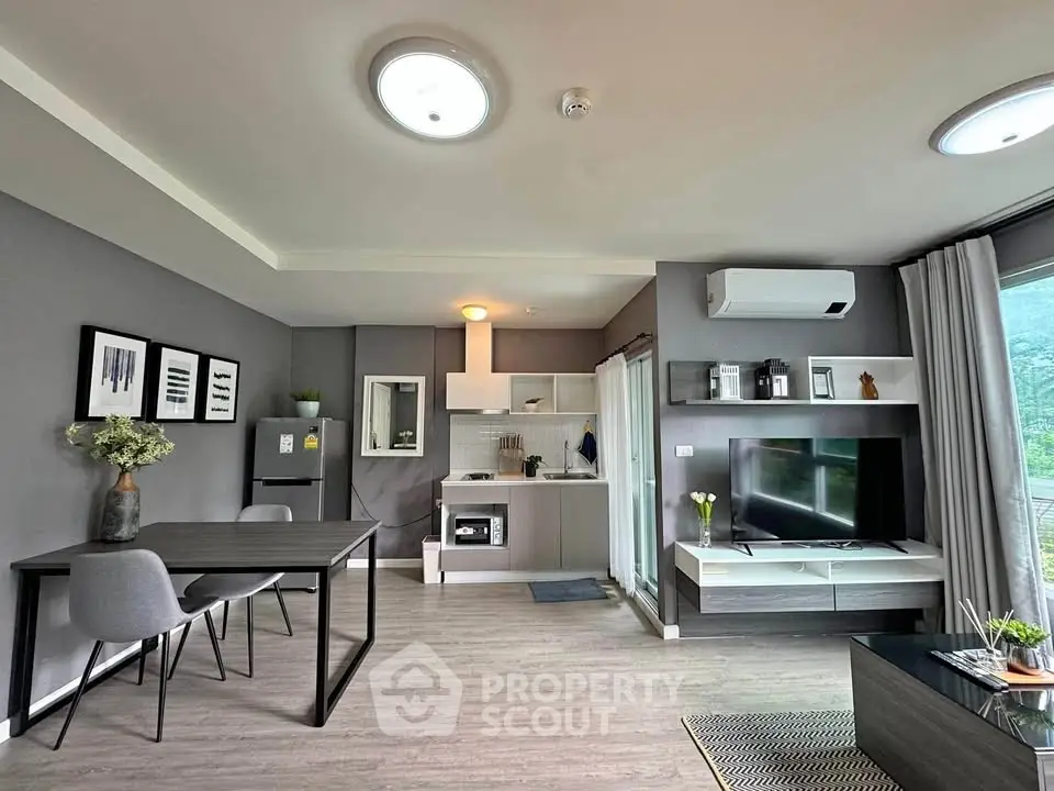 Modern open-plan living room with sleek kitchen and stylish decor