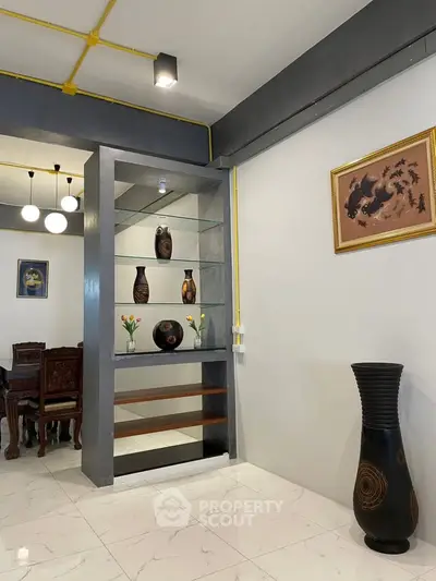 Modern living room with elegant decor and stylish shelving unit