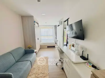 Modern studio apartment with cozy living area and stylish decor