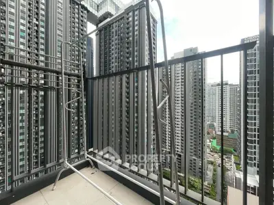 High-rise balcony with stunning cityscape view of modern skyscrapers.