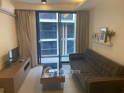 Modern living room with stylish sofa and large window view