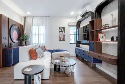 Stylish modern living room with elegant decor and cozy seating area, perfect for relaxation and entertainment.