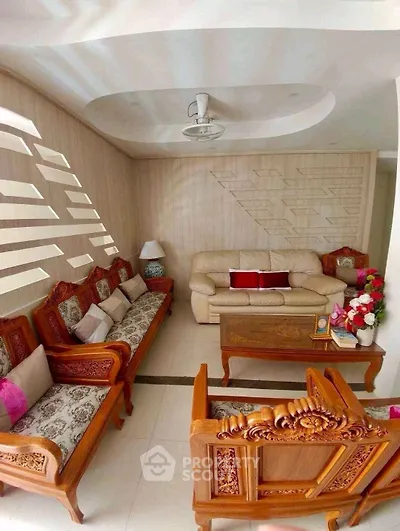 Elegant living room with wooden furniture and modern ceiling design