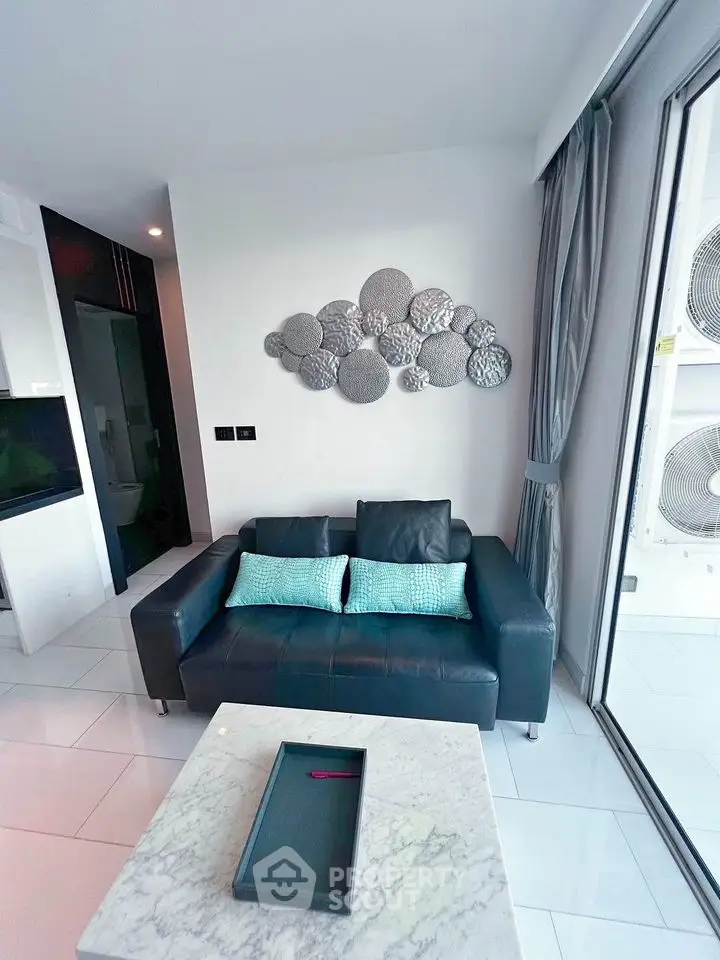 Modern living room with stylish decor and large windows