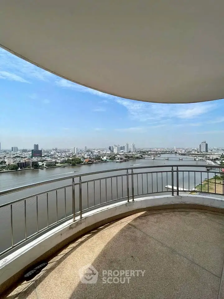 Stunning river view from a spacious balcony in a high-rise building.
