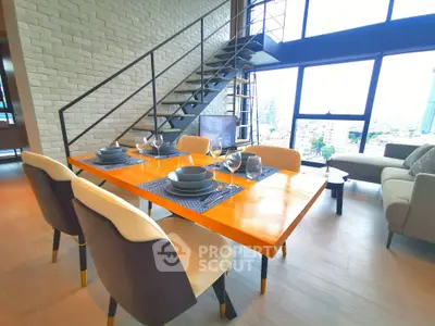 Modern loft living room with dining area and city view