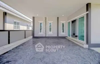 Spacious modern balcony with sliding glass doors and stylish flooring