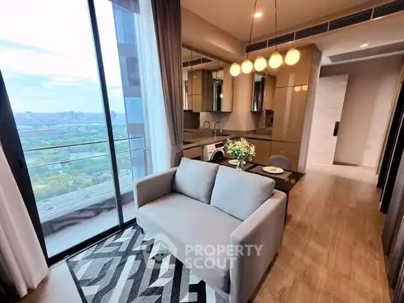 Modern living room with balcony view in high-rise apartment
