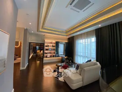 Luxurious living room with elegant lighting and modern decor in a high-end apartment.