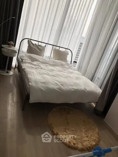 Modern bedroom with large windows and minimalist decor