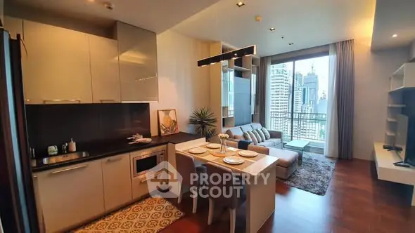 Modern open-plan kitchen and living room with city view