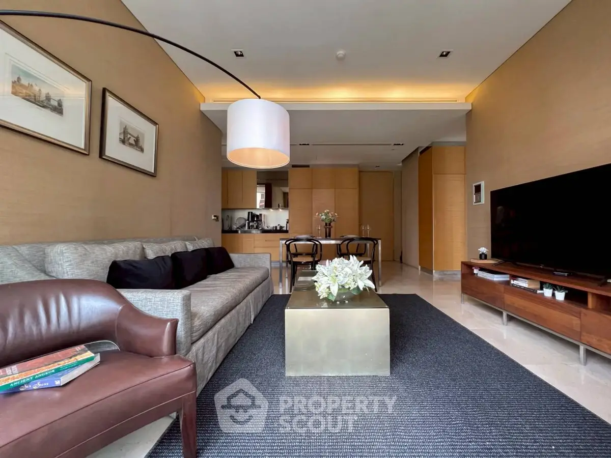 Luxurious living room with modern decor and open kitchen layout